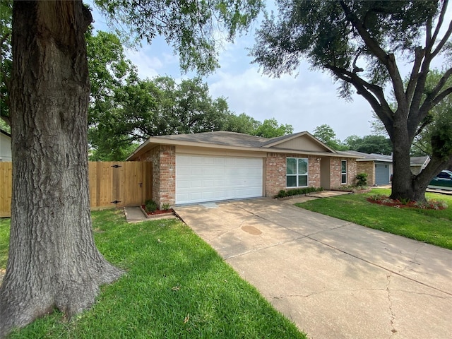10123 Kent Towne Ln, Sugar Land, TX 77498 - ranch-style house with brick siding, an attached garage, and driveway