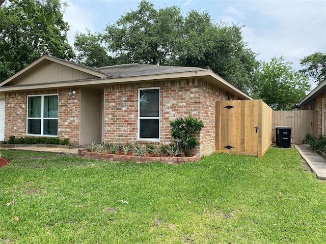 10123 Kent Towne Ln, Sugar Land, TX 77498 - view of front of home featuring brick siding and a gate