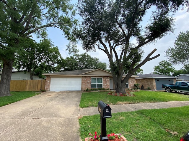 10123 Kent Towne Ln, Sugar Land, TX 77498 - ranch-style home with a garage, driveway, and brick siding