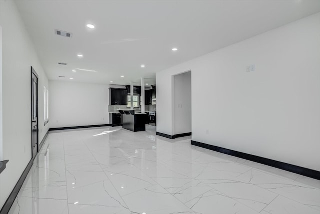 5911 Rietta, Houston, TX 77016 - unfurnished room featuring light marble finish flooring and recessed lighting