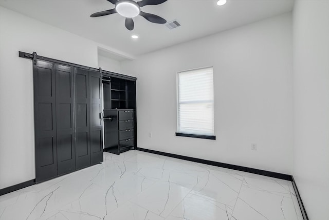 5911 Rietta, Houston, TX 77016 - bedroom with a barn door, light marble finish flooring, recessed lighting, and a ceiling fan