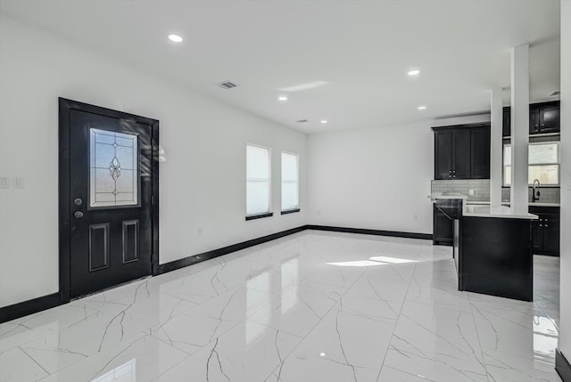 5911 Rietta, Houston, TX 77016 - foyer featuring recessed lighting and light marble finish floors