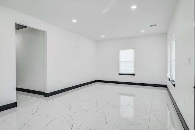 5911 Rietta, Houston, TX 77016 - empty room featuring marble finish floors and recessed lighting