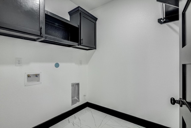 5911 Rietta, Houston, TX 77016 - washroom featuring light marble finish floors, washer hookup, cabinet space, and hookup for an electric dryer