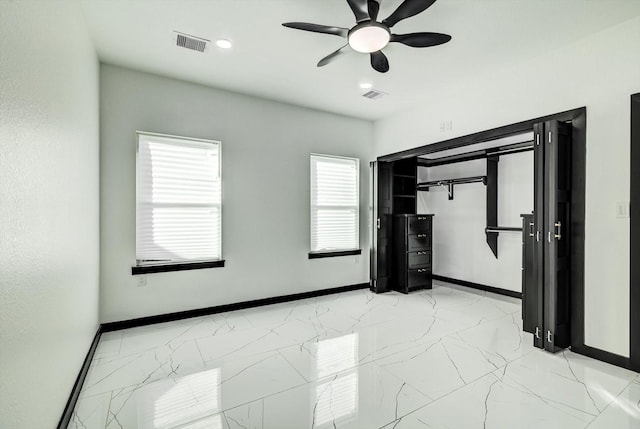 5911 Rietta, Houston, TX 77016 - unfurnished bedroom with light marble finish flooring and a ceiling fan