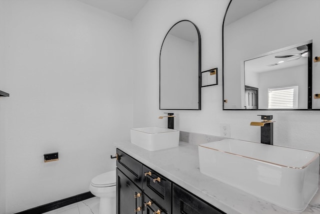 5911 Rietta, Houston, TX 77016 - bathroom featuring marble finish floors, double vanity, and ceiling fan