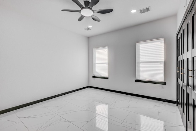 5911 Rietta, Houston, TX 77016 - empty room featuring light marble finish floors, ceiling fan, and recessed lighting