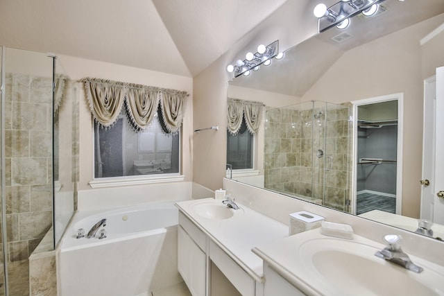 21323 Hannover Frst, Spring, TX 77388 - full bathroom featuring lofted ceiling, a stall shower, a garden tub, double vanity, and a spacious closet