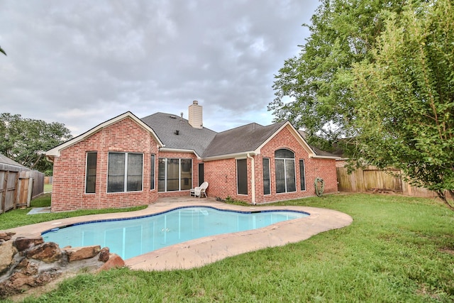 21323 Hannover Frst, Spring, TX 77388 - back of property featuring brick siding, a chimney, and a shingled roof