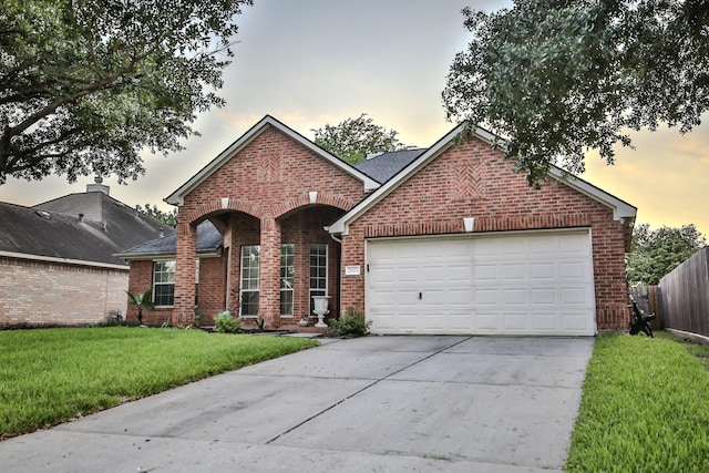 21323 Hannover Frst, Spring, TX 77388 - traditional-style house with brick siding, concrete driveway, and a garage