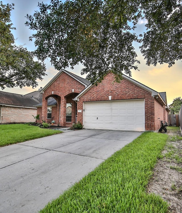 21323 Hannover Frst, Spring, TX 77388 - view of front of house with brick siding, a garage, and concrete driveway
