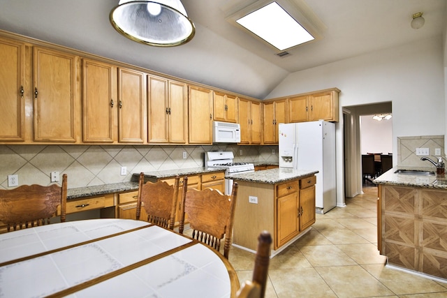 21323 Hannover Frst, Spring, TX 77388 - kitchen featuring white appliances, a sink, decorative backsplash, lofted ceiling, and brown cabinets