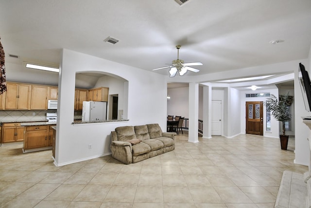 21323 Hannover Frst, Spring, TX 77388 - living area featuring ceiling fan, light tile patterned floors, and baseboards