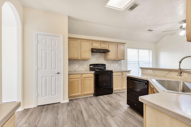 6431 Bright Falls Ln, Katy, TX 77449 - kitchen with black appliances, light brown cabinets, a sink, light wood-style flooring, and vaulted ceiling