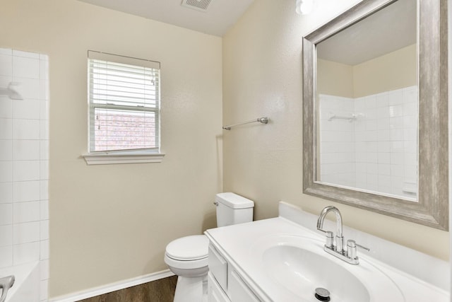 6431 Bright Falls Ln, Katy, TX 77449 - bathroom with wood finished floors, toilet, vanity, baseboards, and shower / bath combination