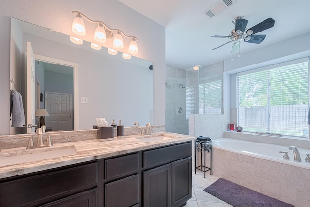 13626 Danbury Run Dr, Houston, TX 77041 - bathroom with plenty of natural light, tiled shower, a ceiling fan, and tile patterned floors