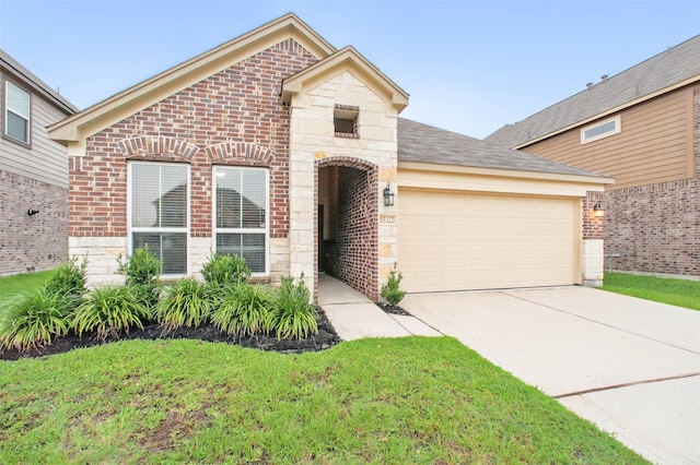 15322 Laceleaf Trl, Houston, TX 77044 - view of front of property featuring brick siding, a garage, concrete driveway, and a front lawn