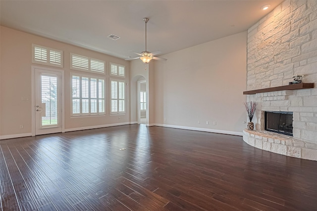 2110 Aztec Thrush Dr, Katy, TX 77494 - unfurnished living room featuring a fireplace, a ceiling fan, dark wood finished floors, and baseboards