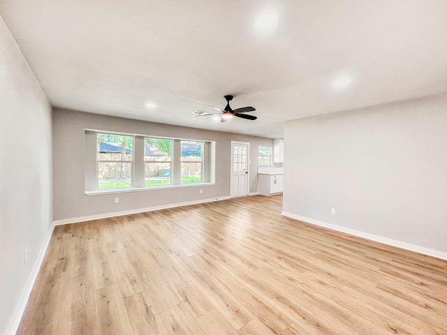 4926 Adonis Dr, Spring, TX 77373 - unfurnished living room featuring light wood-style flooring, a ceiling fan, baseboards, and recessed lighting