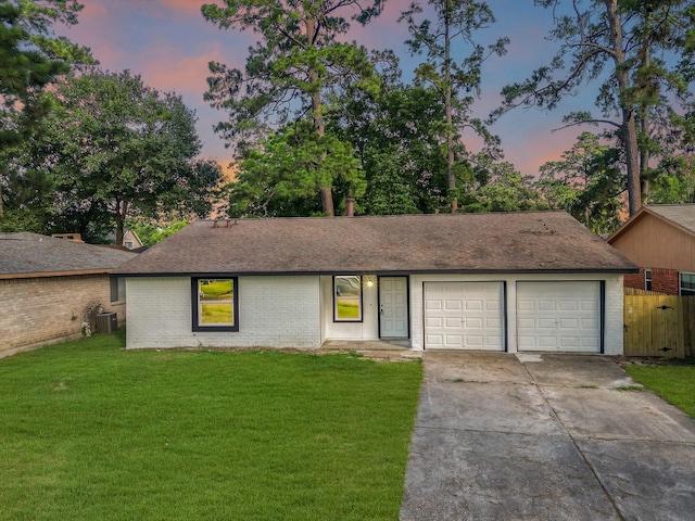 4926 Adonis Dr, Spring, TX 77373 - view of front of house featuring central air condition unit, brick siding, concrete driveway, and an attached garage