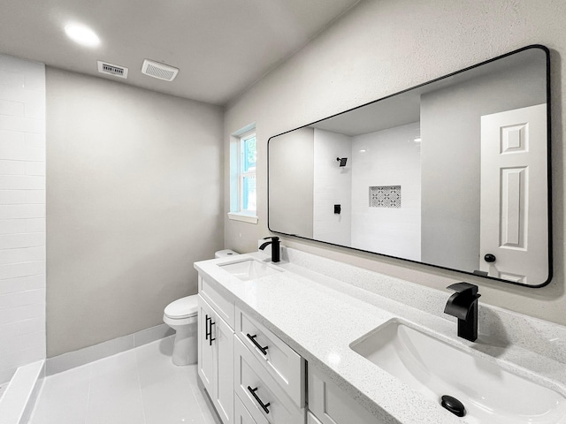4926 Adonis Dr, Spring, TX 77373 - full bath with double vanity, toilet, tile patterned floors, baseboards, and a tile shower