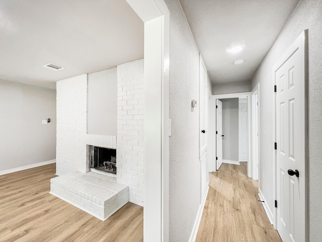 4926 Adonis Dr, Spring, TX 77373 - hall with light wood-style floors and baseboards
