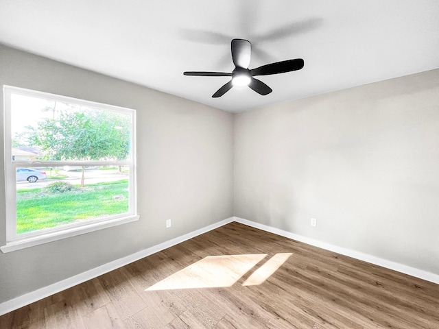 4926 Adonis Dr, Spring, TX 77373 - empty room featuring wood finished floors, baseboards, and a ceiling fan