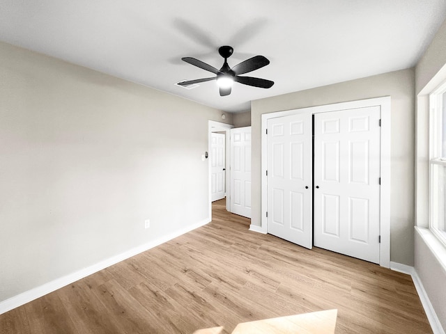 4926 Adonis Dr, Spring, TX 77373 - unfurnished bedroom with light wood-style floors, baseboards, a closet, and ceiling fan