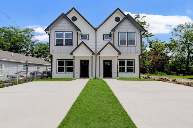 8149 Talton St B, Unit A, Houston, TX 77028 - view of front facade featuring board and batten siding and driveway