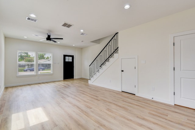 8149 Talton St B, Unit A, Houston, TX 77028 - unfurnished living room featuring light wood-style flooring, ceiling fan, stairway, recessed lighting, and baseboards