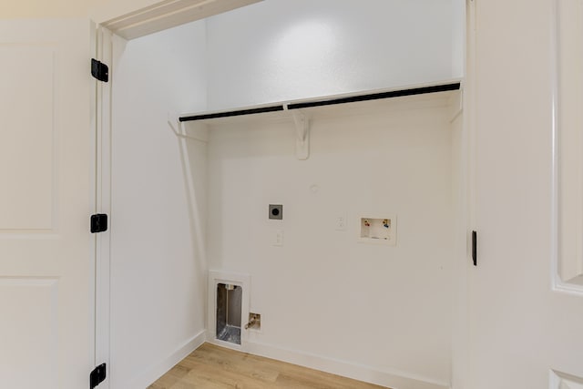 8149 Talton St B, Unit A, Houston, TX 77028 - washroom featuring hookup for an electric dryer, hookup for a gas dryer, light wood-style floors, washer hookup, and baseboards