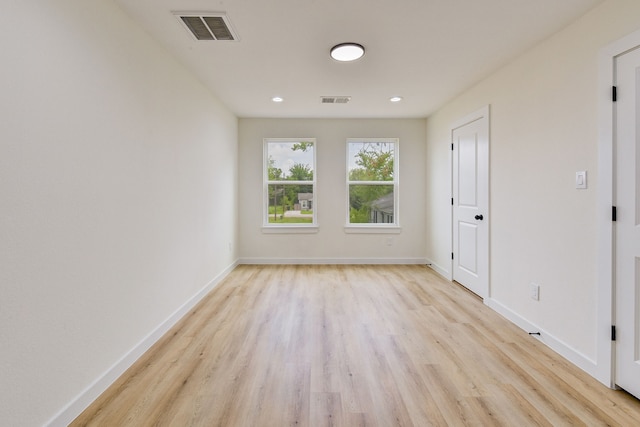8149 Talton St B, Unit A, Houston, TX 77028 - empty room featuring light wood-style flooring, baseboards, and recessed lighting