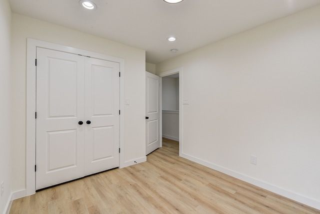 8149 Talton St B, Unit A, Houston, TX 77028 - unfurnished bedroom featuring light wood finished floors, recessed lighting, baseboards, and a closet