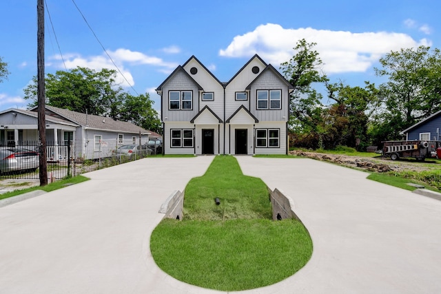 8149 Talton St B, Unit A, Houston, TX 77028 - view of front of property with board and batten siding and concrete driveway