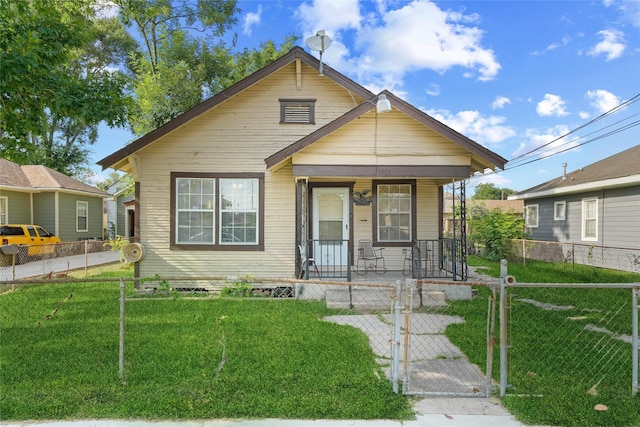 7815 Dayton St, Houston, TX 77012 - view of front of home featuring covered porch and a gate