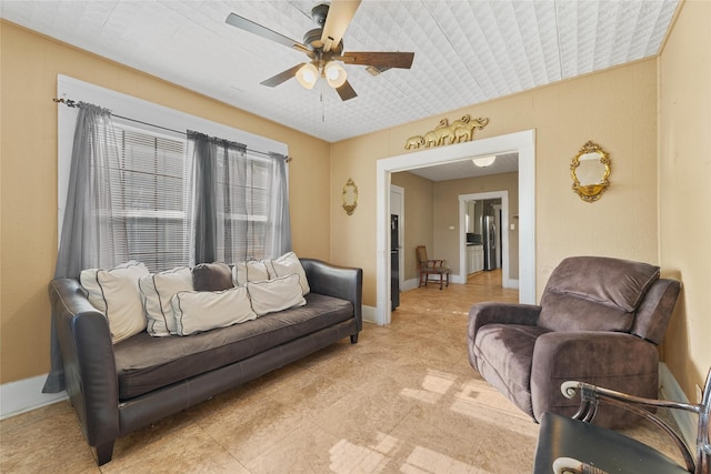 7815 Dayton St, Houston, TX 77012 - living area with ceiling fan, baseboards, and light tile patterned floors