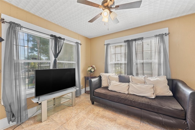 7815 Dayton St, Houston, TX 77012 - living room with healthy amount of natural light, ceiling fan, baseboards, and light tile patterned floors