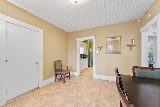 7815 Dayton St, Houston, TX 77012 - sitting room with baseboards and light tile patterned flooring