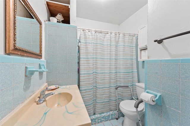 7815 Dayton St, Houston, TX 77012 - full bath with tile walls, toilet, vanity, tile patterned floors, and curtained shower