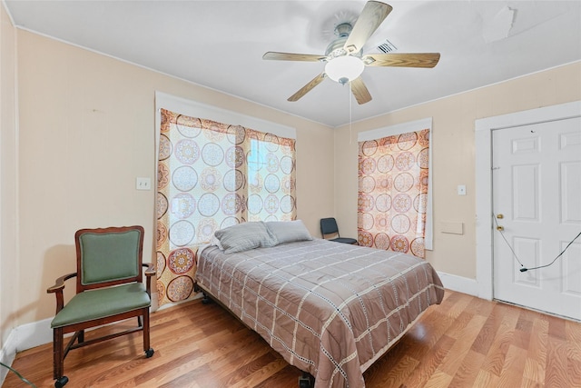 7815 Dayton St, Houston, TX 77012 - bedroom with wood finished floors, baseboards, and ceiling fan