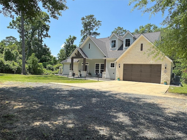 201 Deen Dr, Houston, TX 77336 - view of front facade with a garage, driveway, stone siding, central air condition unit, and a shingled roof