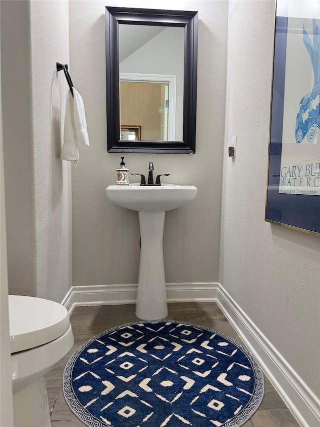 201 Deen Dr, Houston, TX 77336 - half bathroom featuring baseboards and toilet