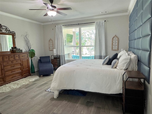 201 Deen Dr, Houston, TX 77336 - bedroom featuring light wood finished floors, crown molding, and ceiling fan