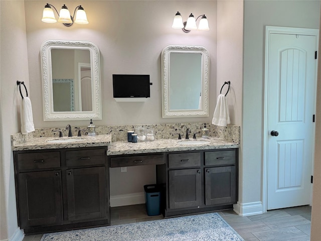 201 Deen Dr, Houston, TX 77336 - full bathroom with double vanity and baseboards