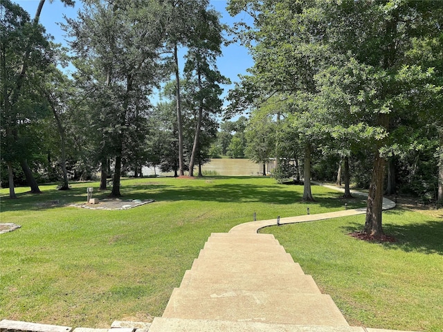 201 Deen Dr, Houston, TX 77336 - surrounding community with a yard and view of scattered trees