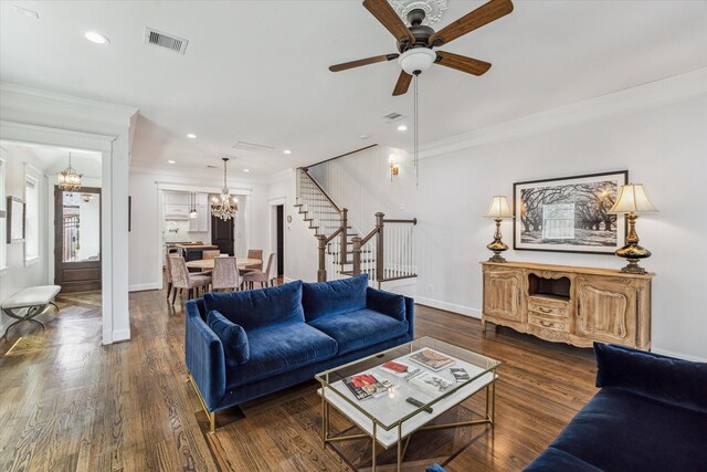 1212 Bingham St, Houston, TX 77007 - living room with a chandelier, stairs, ornamental molding, a ceiling fan, and wood finished floors