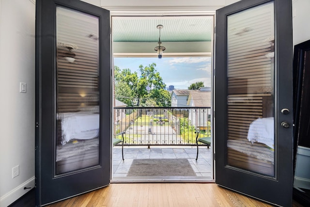 1212 Bingham St, Houston, TX 77007 - doorway with baseboards and wood finished floors