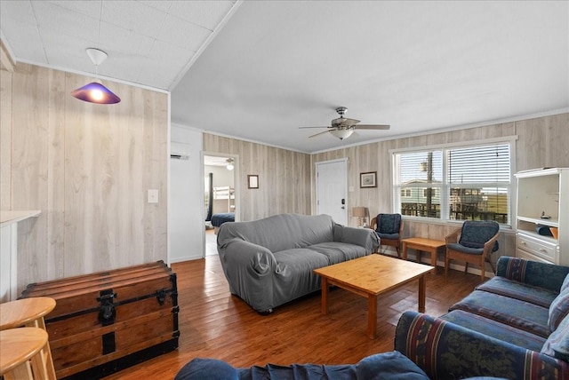 227 Detenbeck Ave, Surfside Beach, TX 77541 - living area with ceiling fan, wood finished floors, wooden walls, and ornamental molding