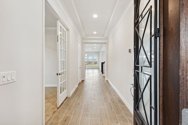5204 Andorra Bend Ln, Porter, TX 77365 - hallway with french doors, crown molding, baseboards, and light wood finished floors