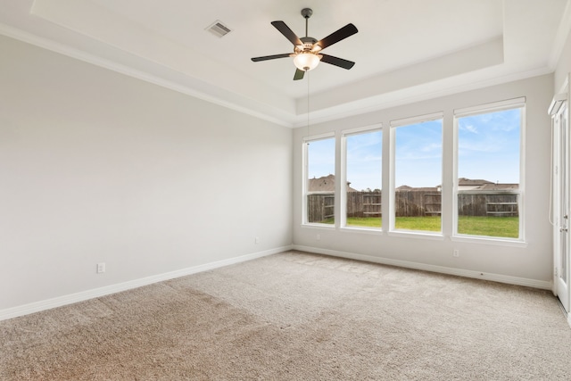 5204 Andorra Bend Ln, Porter, TX 77365 - unfurnished room with a tray ceiling, light carpet, a ceiling fan, baseboards, and crown molding